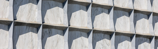 Exterior of the Beinecke Library features powerful stone geometry and marble panes